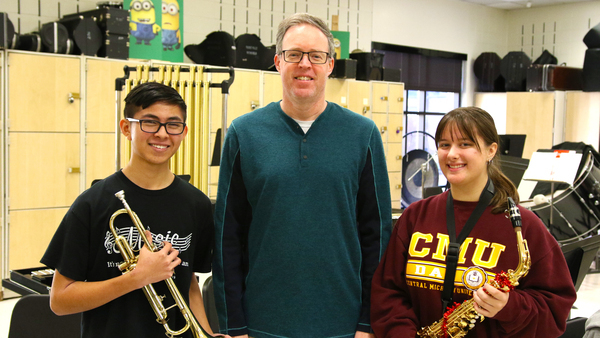 Mr. Chesher and State band students